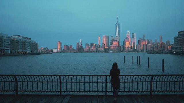 Photographer taking Pictures of Panoramic view of Manhattan at night 4k
