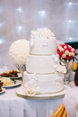 wedding cake with flowers yellow beige red turquoise blue