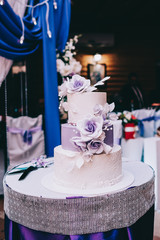 wedding cake with flowers yellow beige red turquoise blue