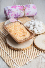 Spa still-life of sea salt and sponge for relaxation care.