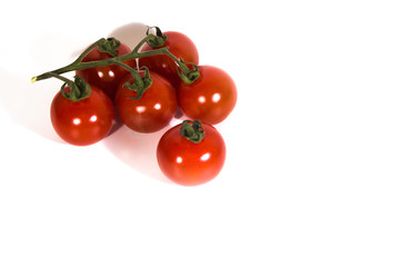 six cherry tomatoes and white background