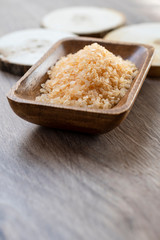 Spa sea salt in wooden bowl closeup