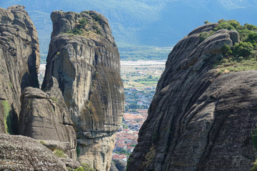 AERIAL: Flying towards a crevice splitting the two smooth towering boulders.