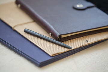 notebook with pen and diary for business