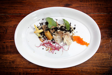 Gourmet dish with truffles, caviar and vegetables