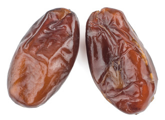 Dates on white background, top view, macro