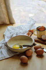 broken eggs in a plate. Beautiful still life, preparing for the text and cooking scrambled eggs