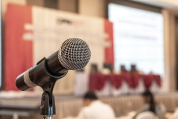 Microphone voice speaker in business seminar, speech presentation, town hall meeting, lecture hall...
