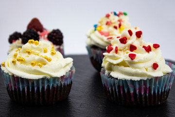 Cupcake, muffin with raisins and chocolate isolated on white background. Delicious homemade Muffins. Top view.