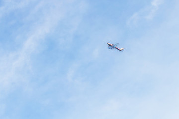 Fototapeta na wymiar Private jet against blue sky and clouds, Puglia, Italy