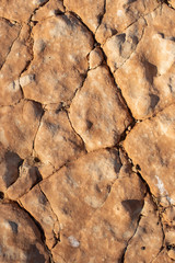 cracked petrified clay soil as background