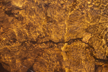 cracked petrified clay under water as background