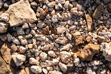 small stones on the shore. background for lettering. multi-colored stones