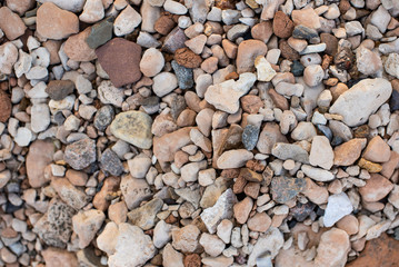 small stones on the shore. background for lettering. multi-colored stones
