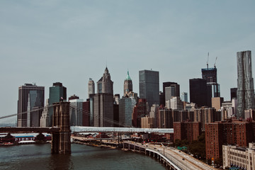 Naklejka premium New York skyline taking while crossing a bridge in the morning. Travel photography