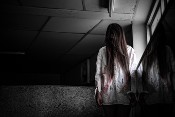 Portrait of asian woman make up ghost face with blood,Horror scene,Scary background,Halloween...