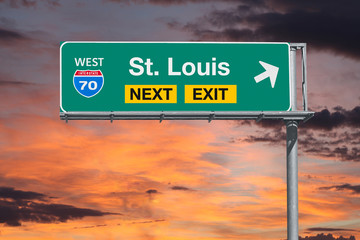 St Louis Missouri route 70 freeway next exit sign with sunset sky. - obrazy, fototapety, plakaty