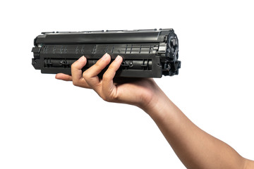 Used laser toner cartridge holding by hand of worker or user for replace, refill  with white...