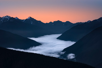 Late summer sunrise as viewed from Hurricane Ridge Lodge showing a fog shrouded Elwha River Valley, Olympic National Park