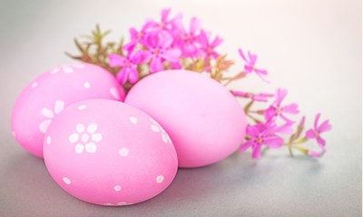 Easter eggs and pastel colored flowers