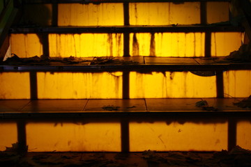 yellow glowing stairs at night