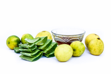 Best method to remove tan at home isolated on white i.e. Aloe vera gel well mixed with some lemon juice in it.Entire raw ingredients present on the surface.