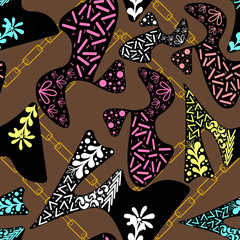 abstract figures with ornaments and golden chains on a light brown color