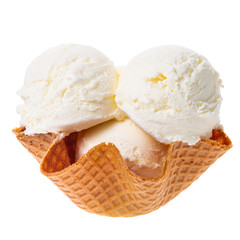 close up of scoops vanilla ice cream in waffle cone bowl isolated on white background