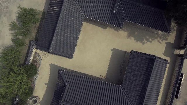 Drone Shot of the Roof of Korean Traditional House in Top View, roll camera, Boom up