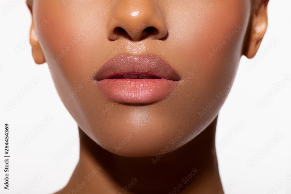 Wall mural beautiful lips close-up. makeup. fashionable portrait girl in neon light background. portrait of bea