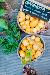 Wicker basket full of lemons on the italian street od Corniglia