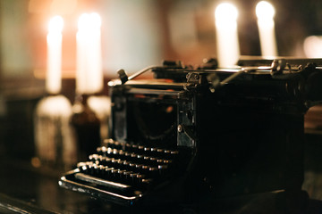 Old typewriter on bokeh background
