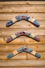 boomerangs on a wooden wall