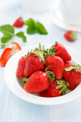 Fresh strawberry in bowl on table