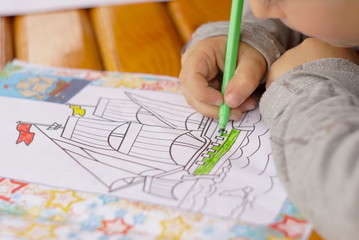 the child draws coloring close up