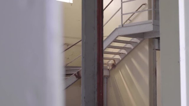 Footage of an Abandoned Prison's Stairs with a grungy look.