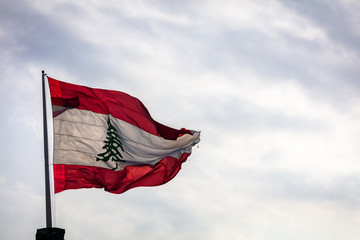 The Lebanese flag flying over Beirut, Lebanon in Spring