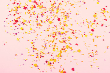 Colorful easter topping on pink background.