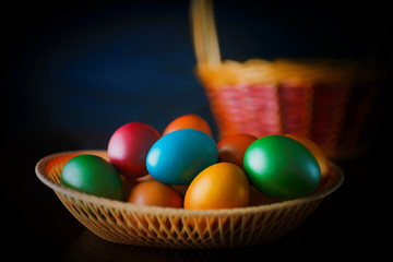 Naklejka na ściany i meble Painted multi-colored paint Easter eggs with a basket