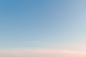Beautiful sunset sky with feathery pink clouds in spring