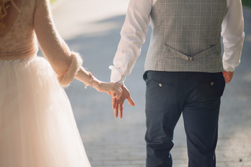 Man and woman hold hands close up