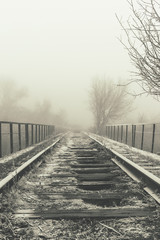 Rails in hoarfrost. Misty autumn morning.