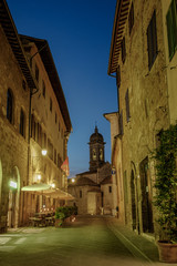 Fototapeta na wymiar Colegiata in San Quirico dOrcia nightscape. Siena Province, Tuscany, Italy.