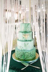 Large green wedding cake close-up on the wedding table