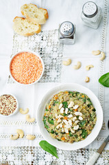 lentils mushroom spinach quinoa with fresh spinach leaves and cashews