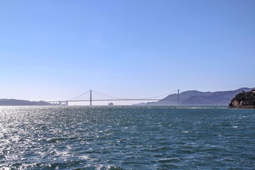 Fototapeta premium Gorgeous Golden Gate Bridge on Blue sky background. San Francisco, California.
