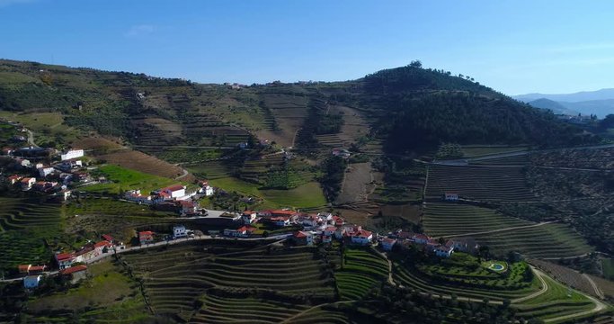 Aerial view of a small village and the terraced vineyards in the Douro Valley near the village of Pinhao, Portugal; Concept for travel in Portugal and most beautiful places in Portugal