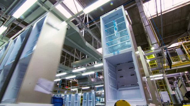 line of modern fridges without doors on conveyor timelapse