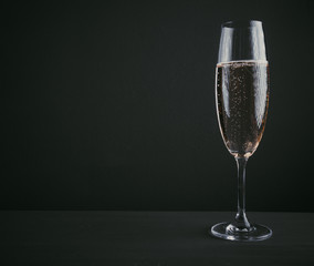 Glass of champagne on a dark background