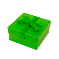 Green gift box with bow isolated on white